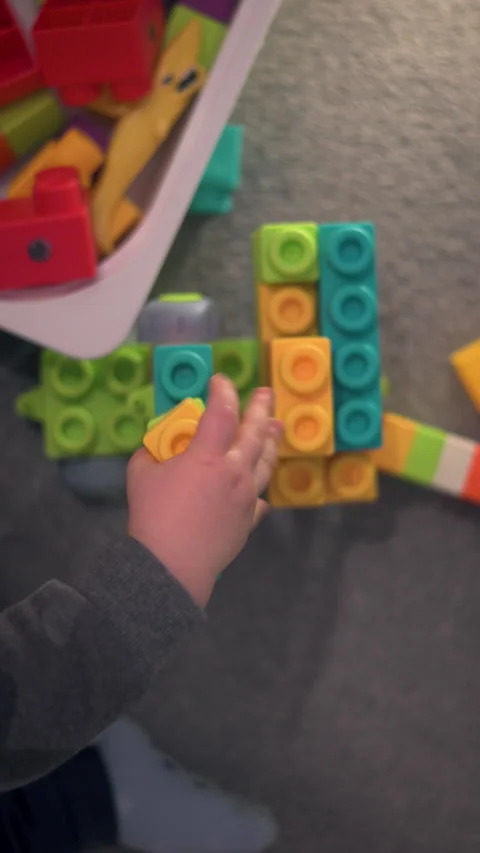 Vertical Top Down View Child Building With Colorful Construction Blocks Stock Footage 330976844