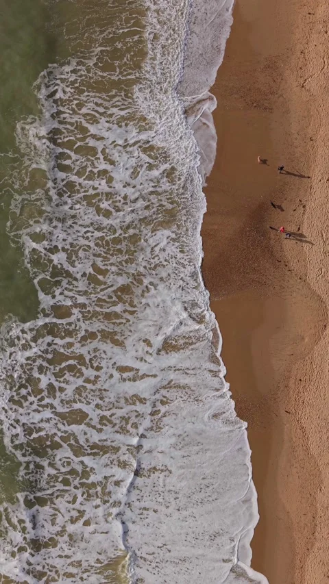 Vertical top down view of a famous beach in Bournemouth UK in late autumn Stock Footage 321702396
