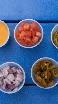 Vertical Top-Down View of Fresh Burger Toppings and Sauces Stockfoto's