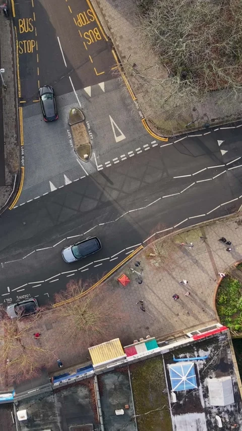Vertical Top down view of Wanstead t-junction, traffic and road markings Stock Footage 327788164