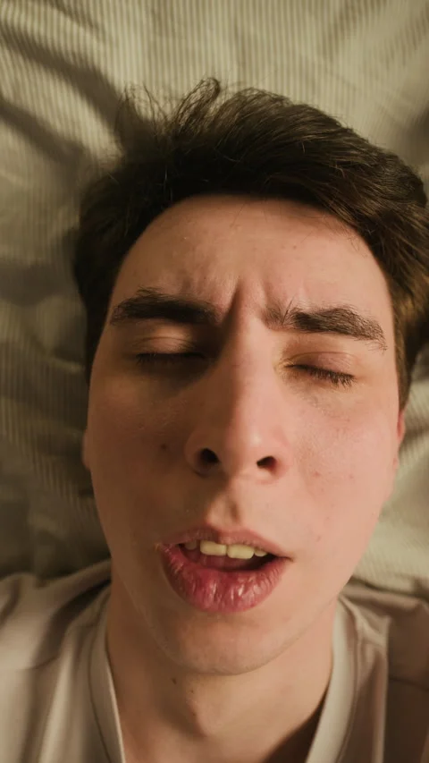 Vertical Top View of Furious Gen Z Man Shouting Loudly in Bed Stock Footage 330661359