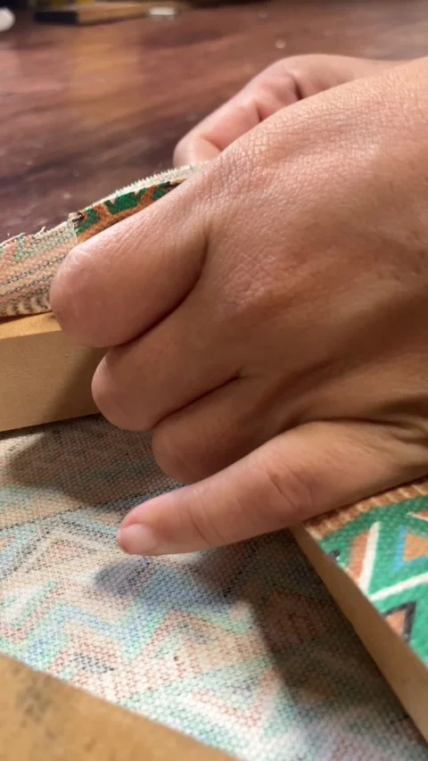 Vertical Top View Hands Neatly Folding Canvas Corner On Wooden Frame.-1 Stock Footage 344839832