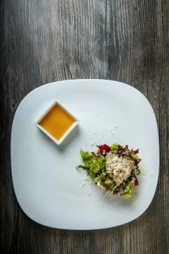 Vertical top view on healthy caesar salad with rubbed cheese and sauce Stock Photos