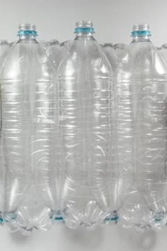 Vertical top view of a Pack of standing Bottles of a liter and a half of empt Stock Photos