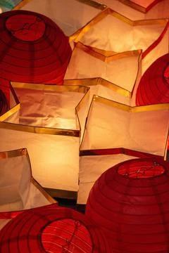 Vertical top view of round and formless illuminated paper lanterns Stock Photos