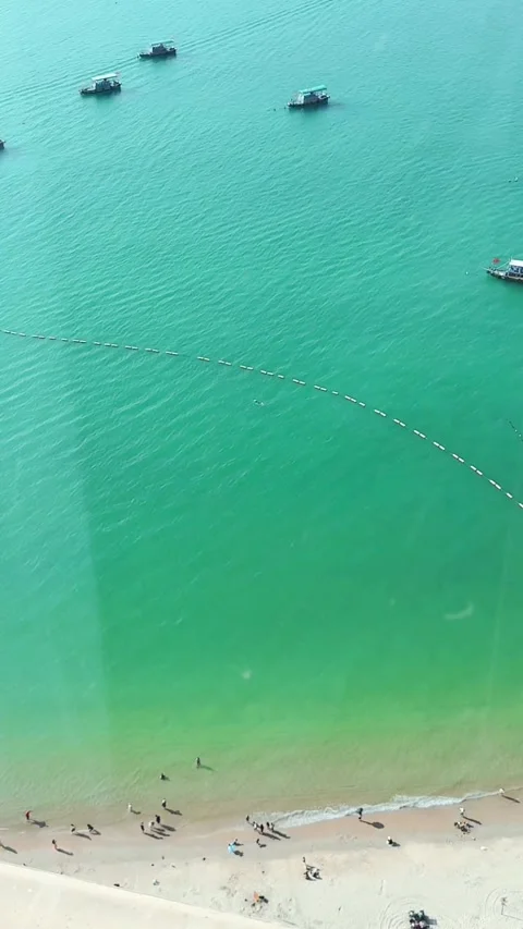 Vertical Top View Of Turquoise Sea And Beach In Sanya Video stock 334013720