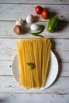 Vertical top view of uncooked spaghetti pasta Stock Photos