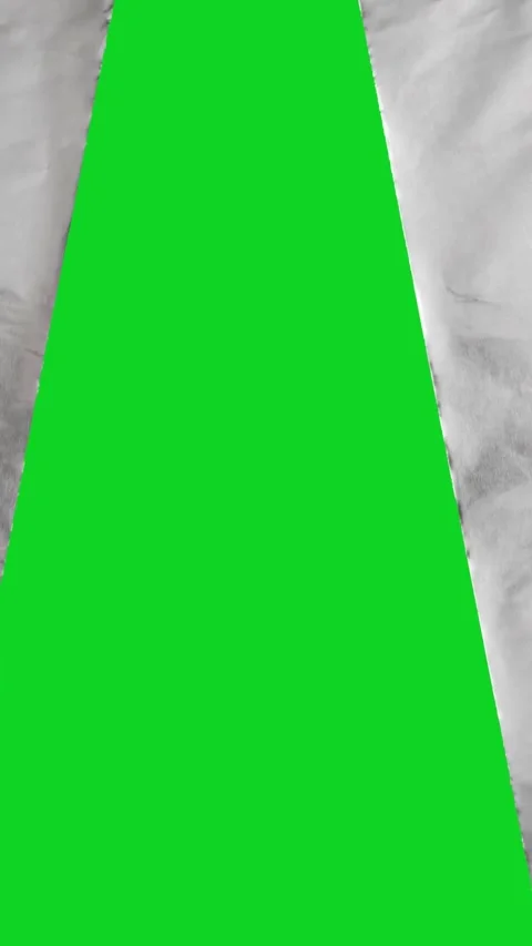Vertical torn crumpled white grunge paper split revealing animated on green Stock Footage 335216659