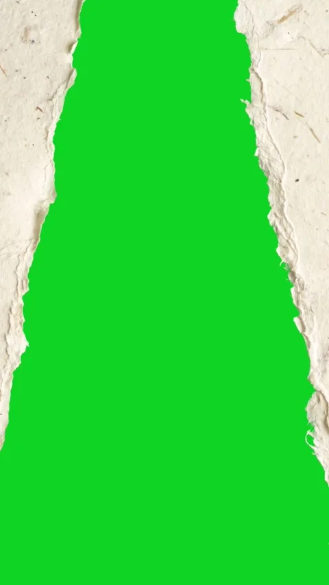 Vertical torn recycled speckled paper split rip revealing animated on green Stock Footage 335216685