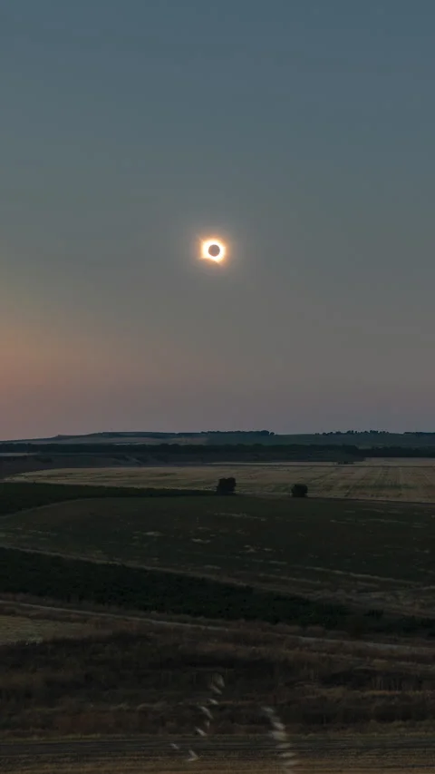 Vertical total solar eclipse timelapse over Spanish countryside at sunset Stock Footage 342130756