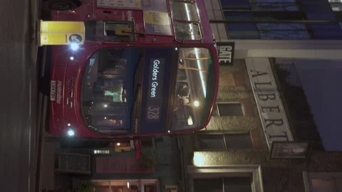 Vertical Tracking Shot Red Public Bus Number 328 Turning Right Going to Vídeos de archivo 171799563