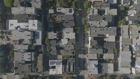 Vertical tracking top-down view of houses Stockbeeldmateriaal 336792540