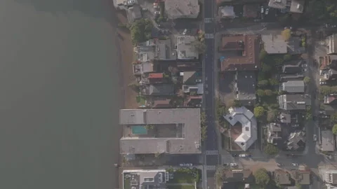 Vertical tracking top-down view of riverbank in San Francisco Видео 336793059