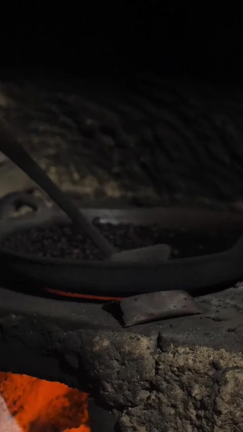 Vertical of Traditional process boil and roasting coffee on coals Stock Footage 278473455