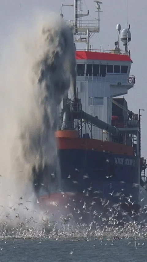 Vertical - Trailing suction hopper dredger Volvox Olympia rainbowing Stock Footage 316230151