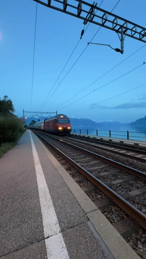 Vertical train approaching railway tracks Lake Geneva Switzerland Stockbeeldmateriaal 333085996