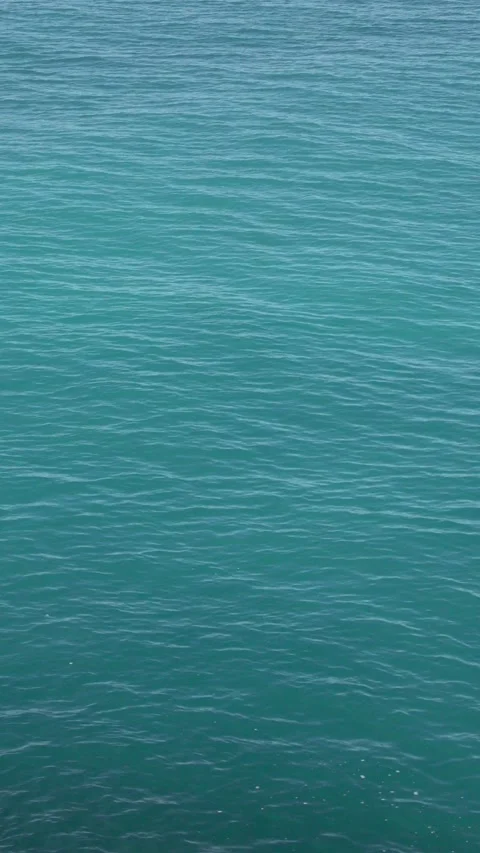 Vertical turquoise sea water, elevated view motion background Video stock 332755690