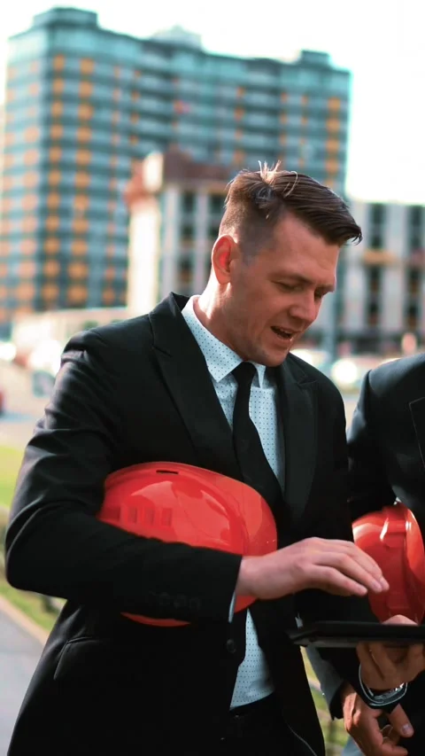 Vertical of Two architect customers discuss their project with Tablet PC Stock Footage 305517461