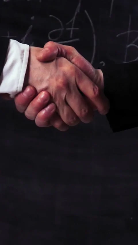 Vertical of Two scientists make handshake Stock Footage 305473466