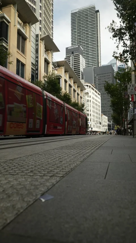 Vertical two Sydney trams pass through city centre 6K Stock Footage 306564954