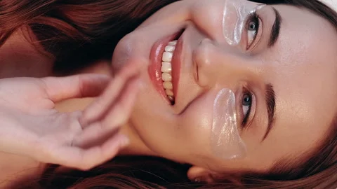 Vertical under eye skin cosmetic patches woman Stock Footage 252106399