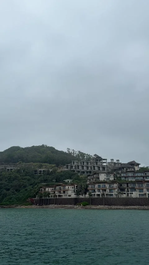 Vertical - Unfinished Concrete Structures Above Coastal Luxury Resort Stock Footage 330915019