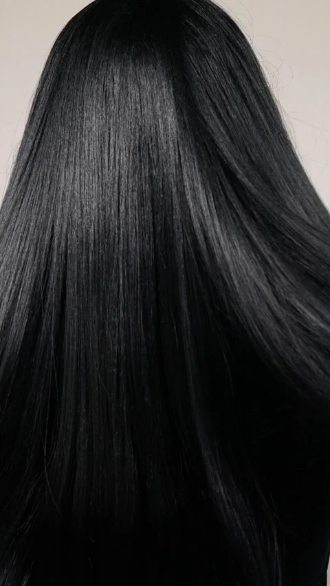 Vertical unrecognizable female model with long black straight hair, slow motion Video stock 289363536