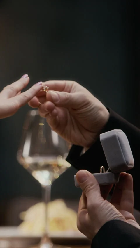 Vertical of Unrecognizable Man Proposing in Romantic Restaurant Setting Stock Footage 333393062