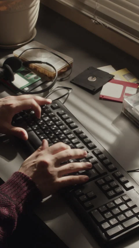 Vertical of Unrecognizable Programmer Typing Code on Old Computer Stock Footage 276414939