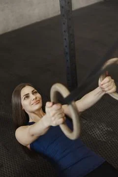 Vertical upper-angle shot smiling, strong and energized, motivated woman workout Stock Photos