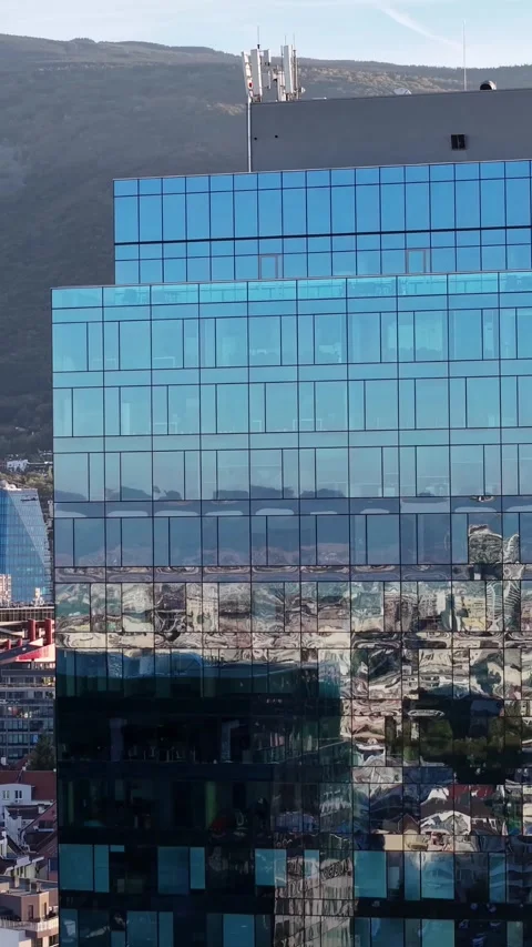 Vertical Upper glass facade and distant skyline Video stock 347025434