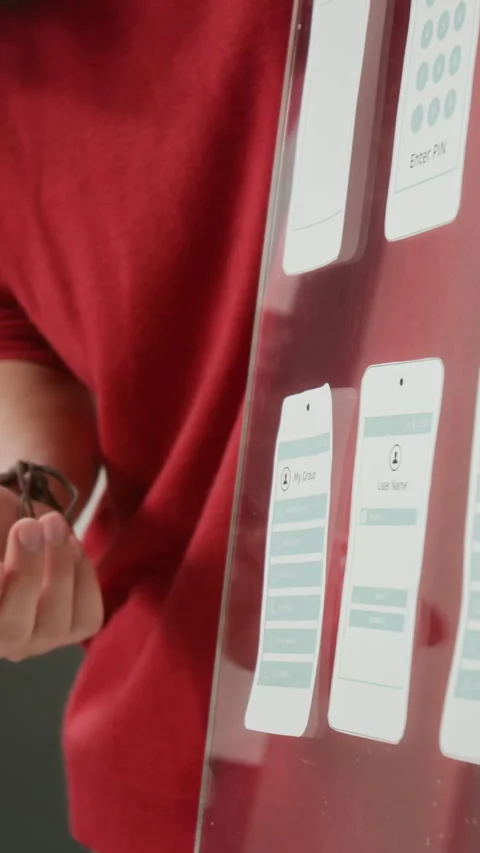 Vertical of UX Developer Demonstrating Wireframe Designs at Team Meeting Stock Footage 327897648