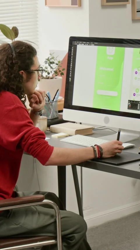 Vertical of UX Developer Drawing Mockups for Mobile Application on Tablet Stock Footage 327899213