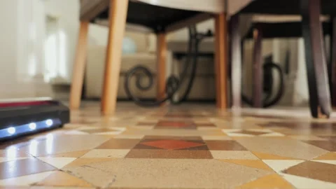 Vertical vacuum cleaner with LED light used on floor. Close-up of vacuum cleaner Stock Footage 302985298