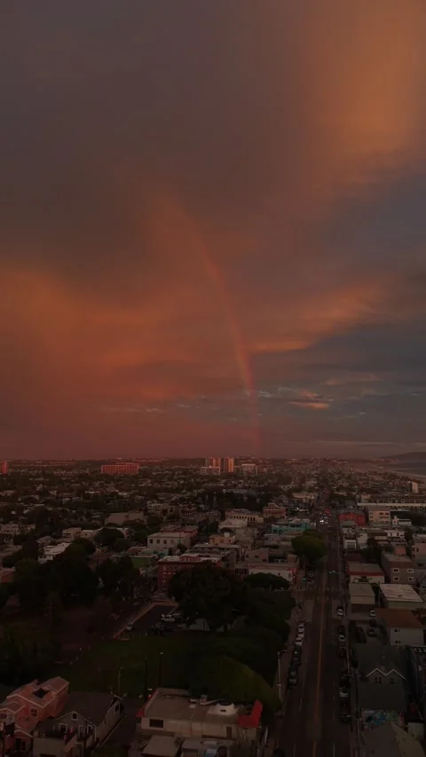 Vertical Venice Beach Aerial Under Red Storm Clouds and Rainbow Stock Footage 344919783