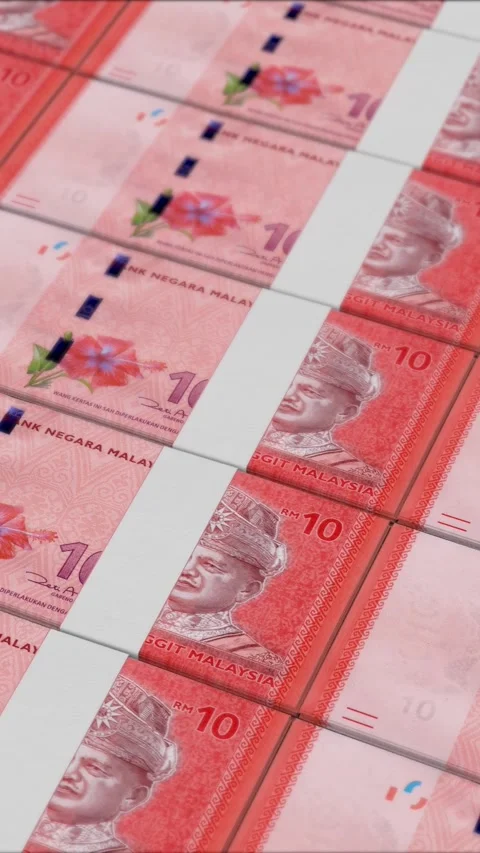 Vertical video of 10 MALAYSIAN RINGGIT banknotes printed by a money press Stock Footage 303207859
