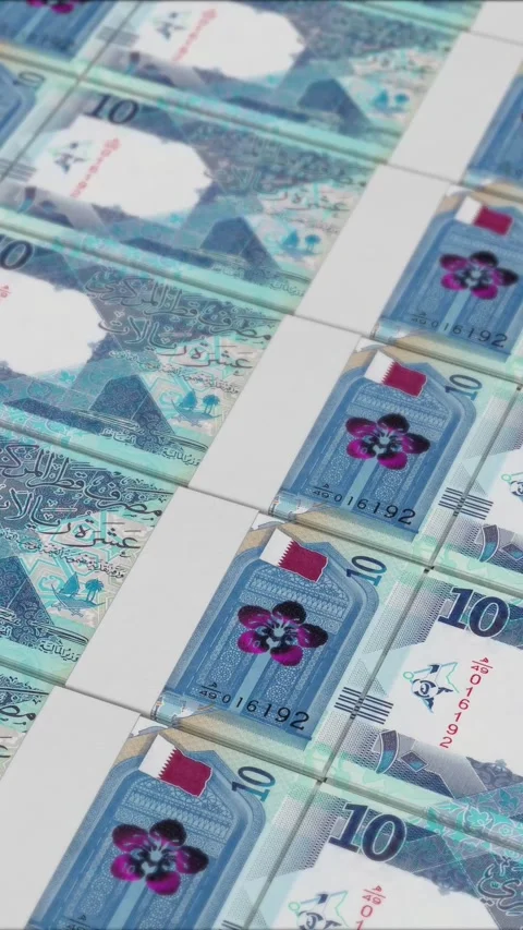 Vertical video of 10 QATARI RIYAL banknotes printed by a money press Stock Footage 303208233