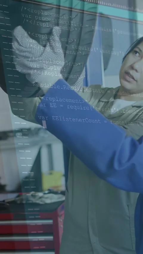 Vertical video: 2 auto techs checking tread wear, left gloved tech touching Stock Footage 334600547