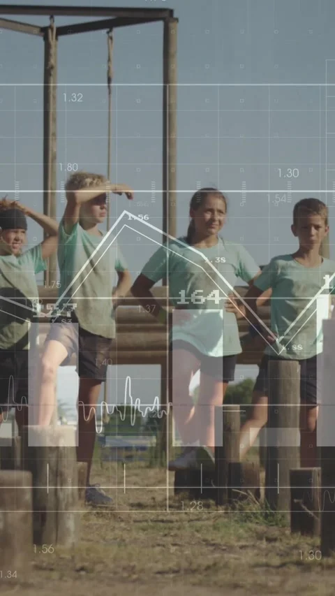 Vertical video: 4 kids balancing on posts, drill starting, data overlays over Stock Footage 331128692