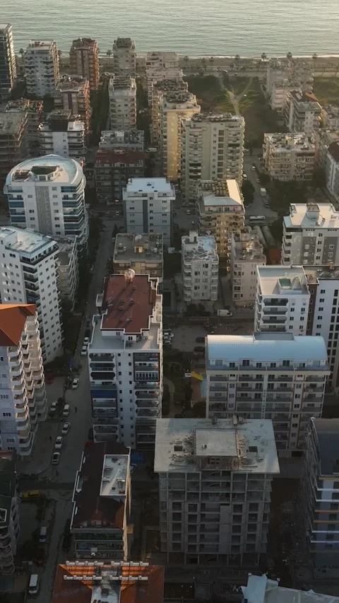 Vertical Video: Above the Building Buzz - Aerial Perspective of Construction Stock Footage 245221403