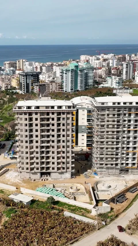 Vertical Video: Above the High-Rise Grounds - Aerial View of Construction Site Stock Footage 245190139