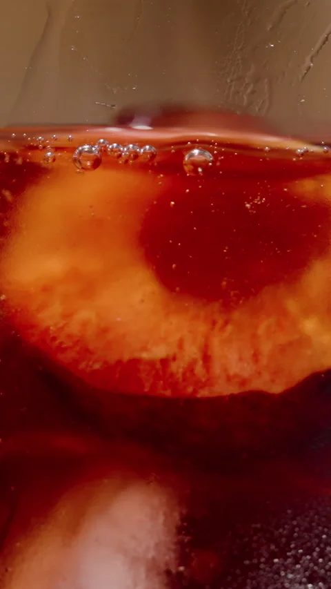 Vertical video. Adding a Cherry Half to a Cocktail Glass, Macro. Stock Footage 279532005