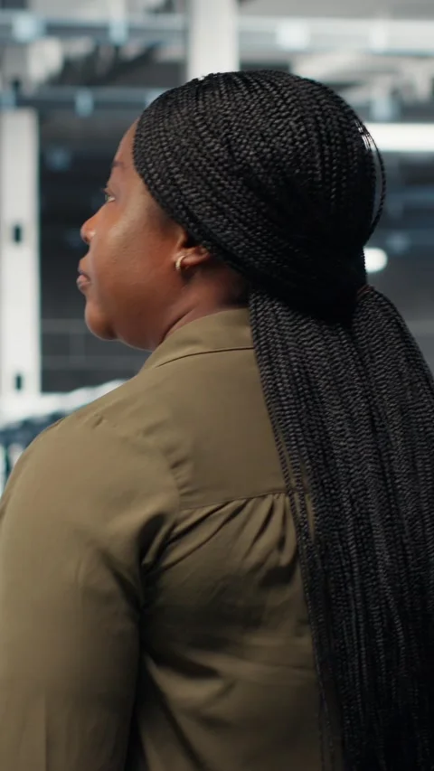 Vertical video Admin in data center workplace overseeing large scale IT Stock Footage 316858598