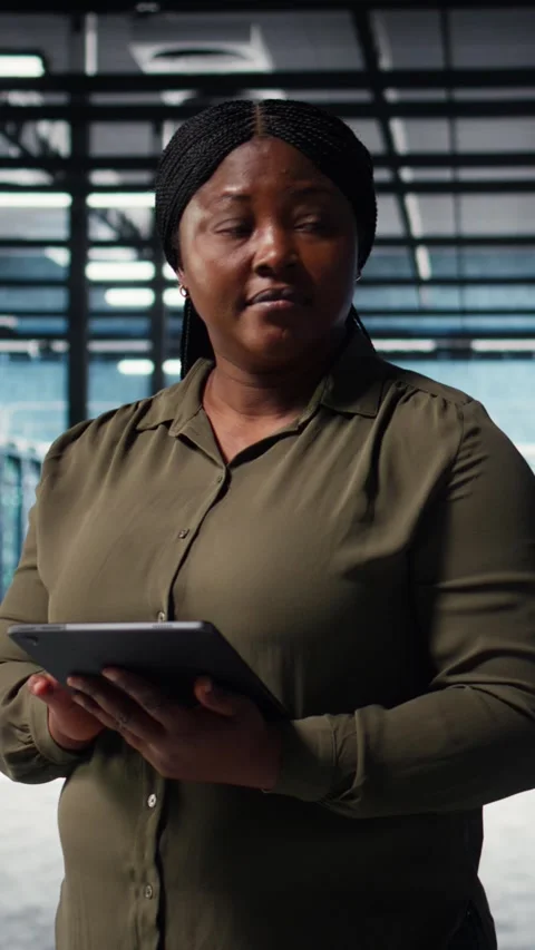 Vertical video Admin in high tech data center using tablet to deploy new server Stock Footage 316859625