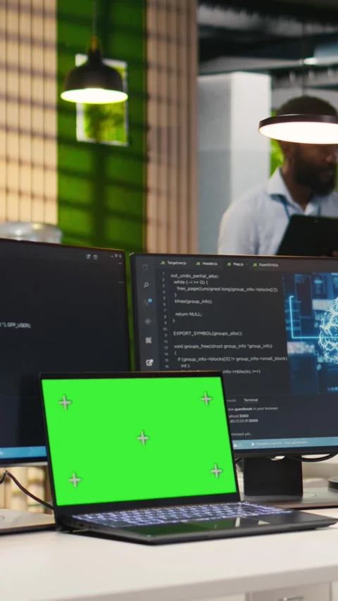 Vertical video Admin in office uses isolated screen laptop, automating Stock Footage 312768432