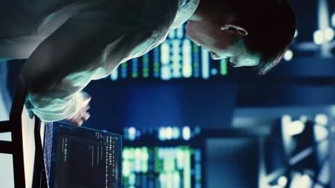 Vertical video Admin runs code in server farm Stock Footage 249843495