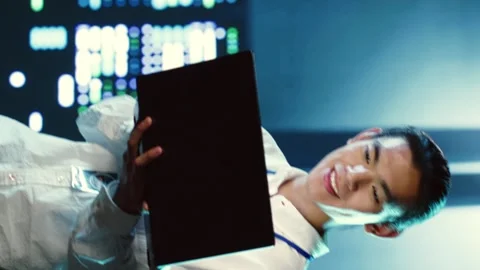 Vertical video Admin wandering around data center Stock Footage 250360512