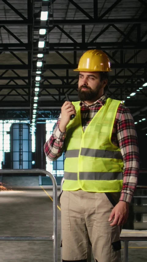 Vertical Video Adult engineer, two-way transmitter, radio signal communication Stock Footage 330439832