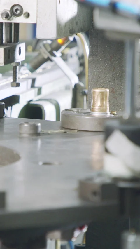 Vertical video of Advanced robotic machine manufacturing parts in an automated Stock Footage 206323276