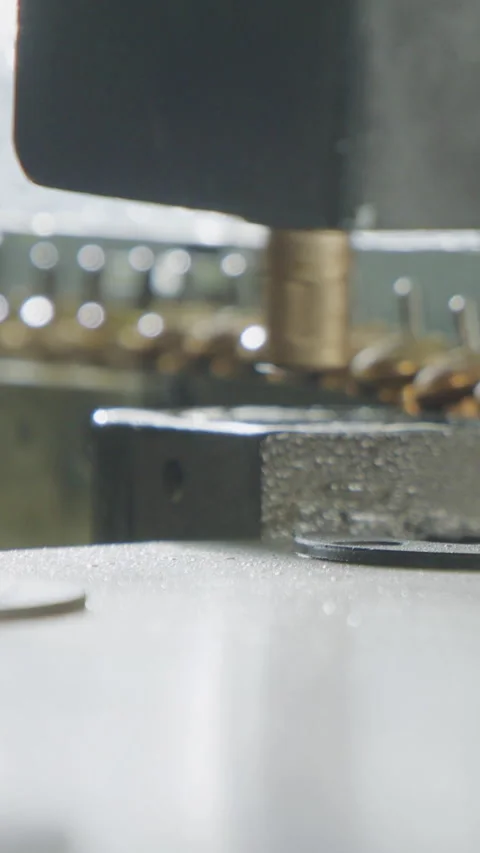 Vertical video of Advanced robotic machine manufacturing parts in an automated Stock Footage 206325078